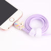 Rainbow Unicorn Cable Charger rolled up plugged in to Iphone
